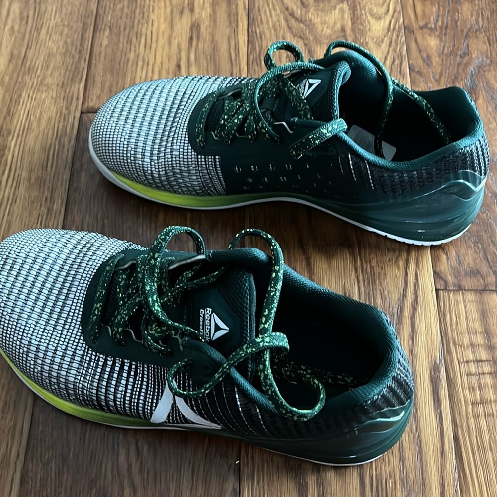 Women’s size 8 1/2 Reebok CrossFit shoes
Like new dark green/white/black.